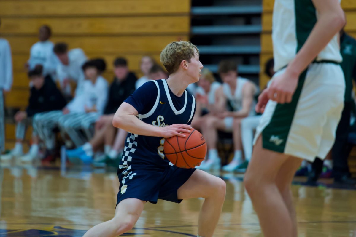 FINDING OPTIONS. Senior Ben Sieben's head was on a swivel looking for a good option to pass to.