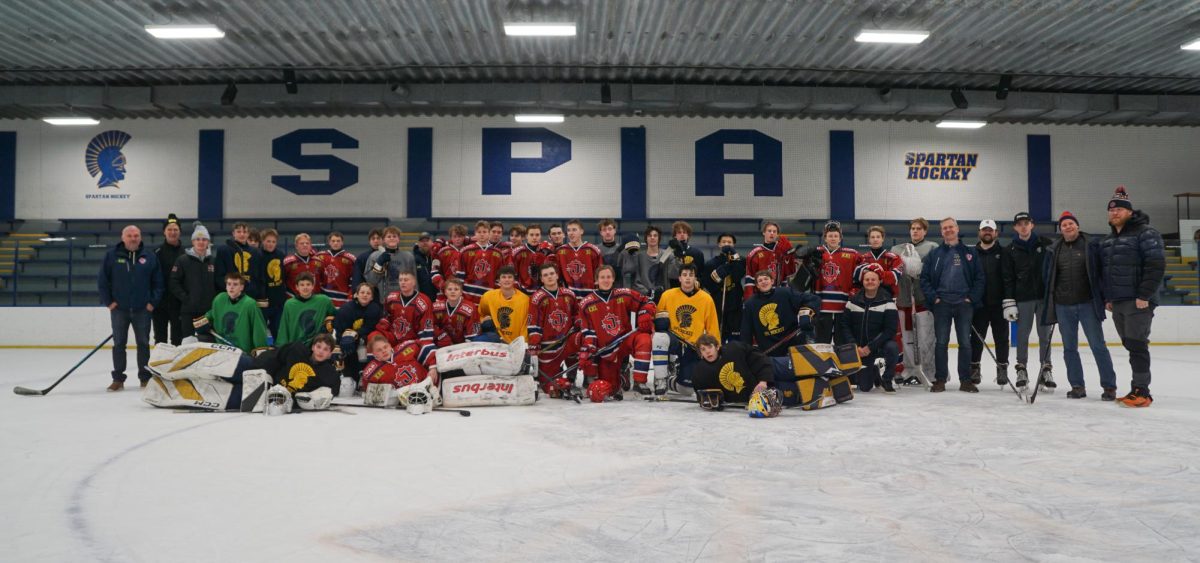 TWO COUNTRIES, ONE GAME. Swedish players from the under-18 Järfälla Hockey Club team joined the Spartan hockey team on the ice for a practice Dec. 29. The exchange was initiated by Järfälla team manager and former Spartan hockey player Dave Landes (‘92).