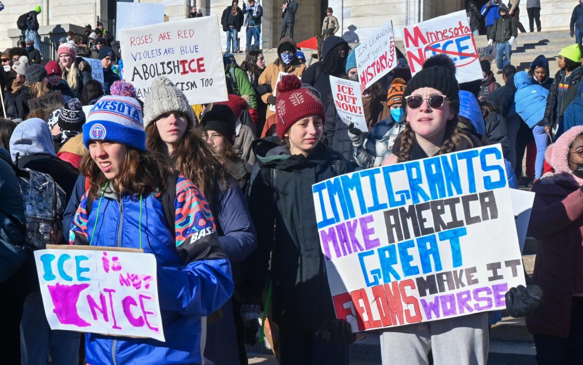 ICE IS NOT NICE. Students holding handmade signs move toward the bottom of the Capitol steps.