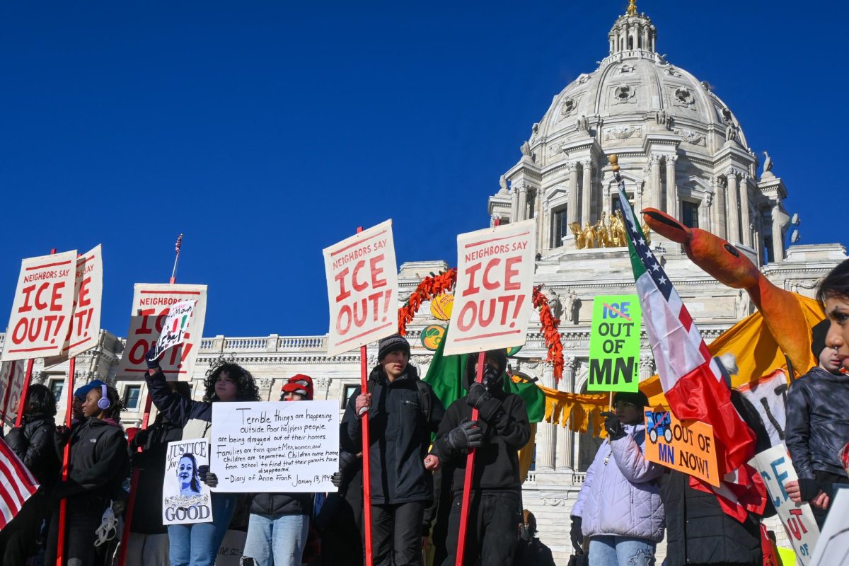 RESIST AND RALLY. Student protesters and organizers stand on the Capitol steps overlooking the crowd.