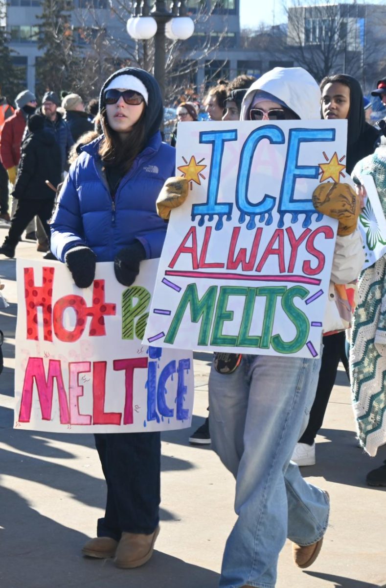 WITTY WORDS. Protesters carried clever handmade signs, highlighting that the event was youth-led.