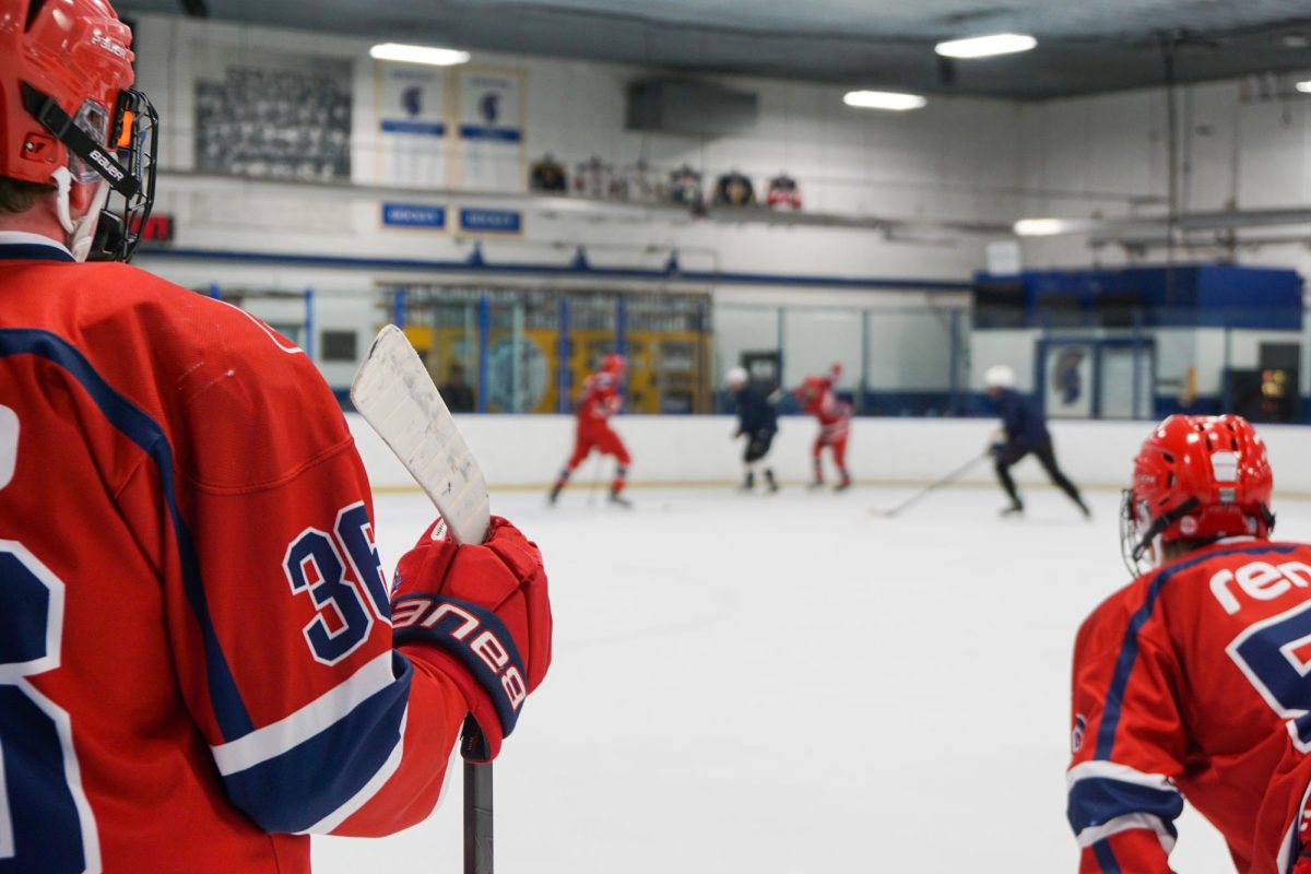 CLOSE COMPETITION. Järfälla players watch their teammates scrimmage against Spartan players.