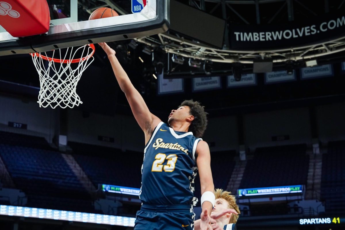LAYUP. Senior Ezra Cunningham puts in two points making the score 43-44 against the Mustangs.