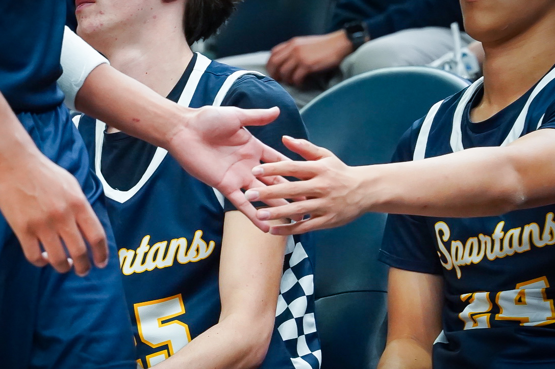 SUPPORT. After players returen to the bench for a substitution, players went down the bench high-fiving one another.