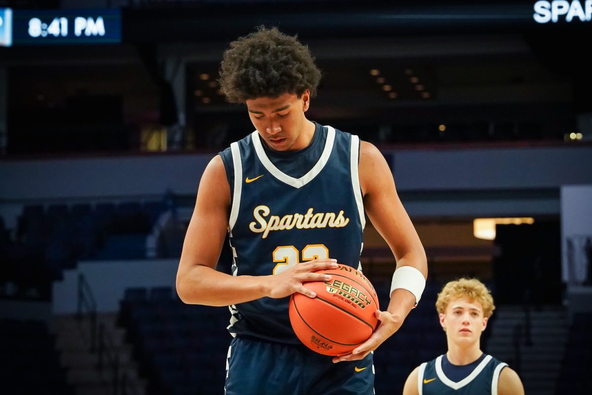 BREATHE. Cunningham does his routine before taking a shot at his free throws.