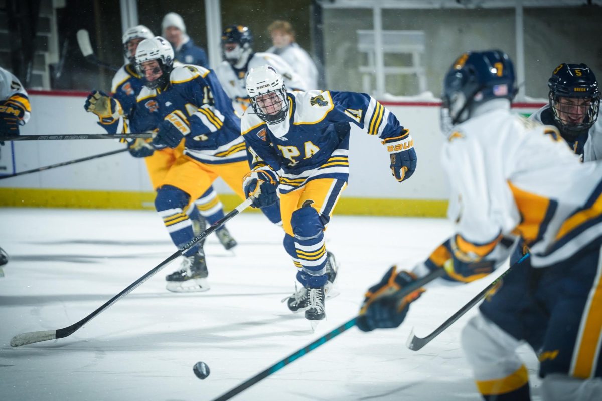 EYES UP. Alex York looks up to track the puck.