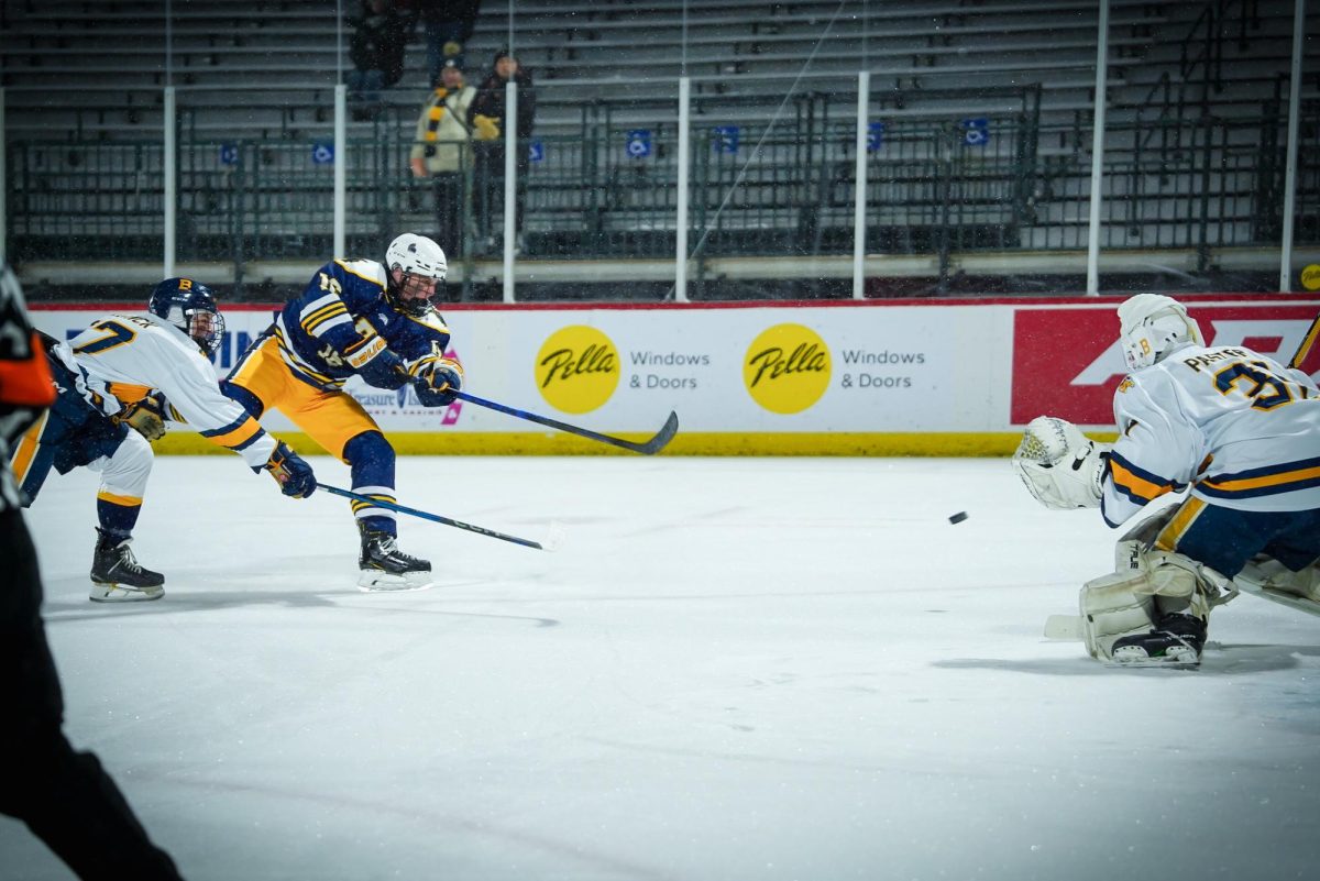 SHOT. Glenn takes a shot at the Mustangs' goalie.