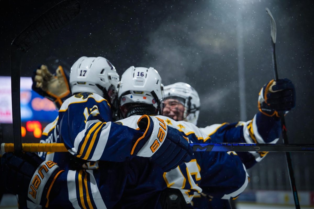 SUPPORT. After a goal by Glenn, the Spartans came together to cheer him on.