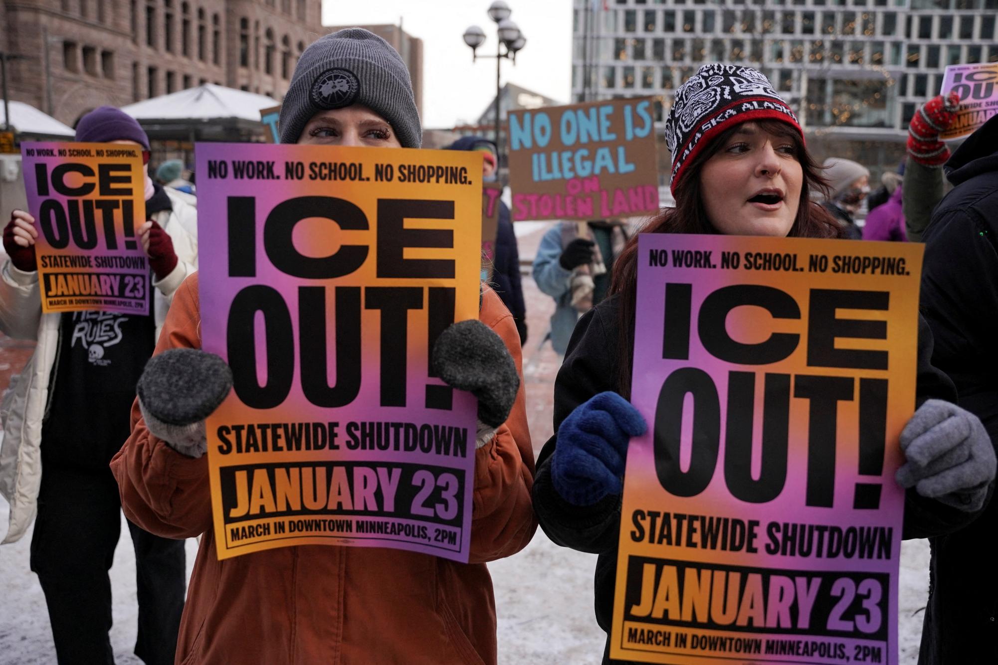 Protesters hold “ICE Out” signs in downtown Minneapolis during the Jan. 23 general strike, as thousands gathered in subzero temperatures to demonstrate against immigration enforcement actions. REUTERS/Seth Herald
