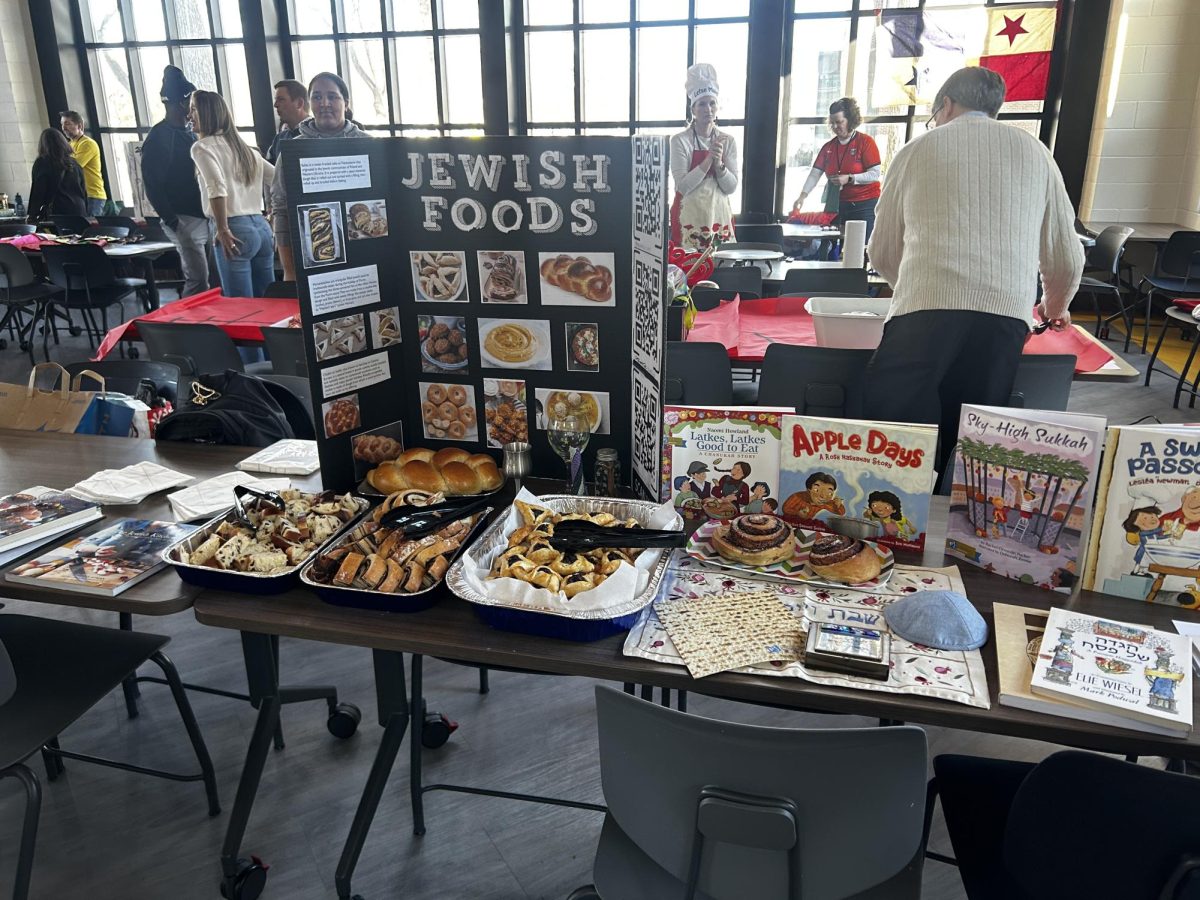 JEWISH BREADS. Sophomore Naomi Mann displayed a variety of traditional Jewish breads at her stall.