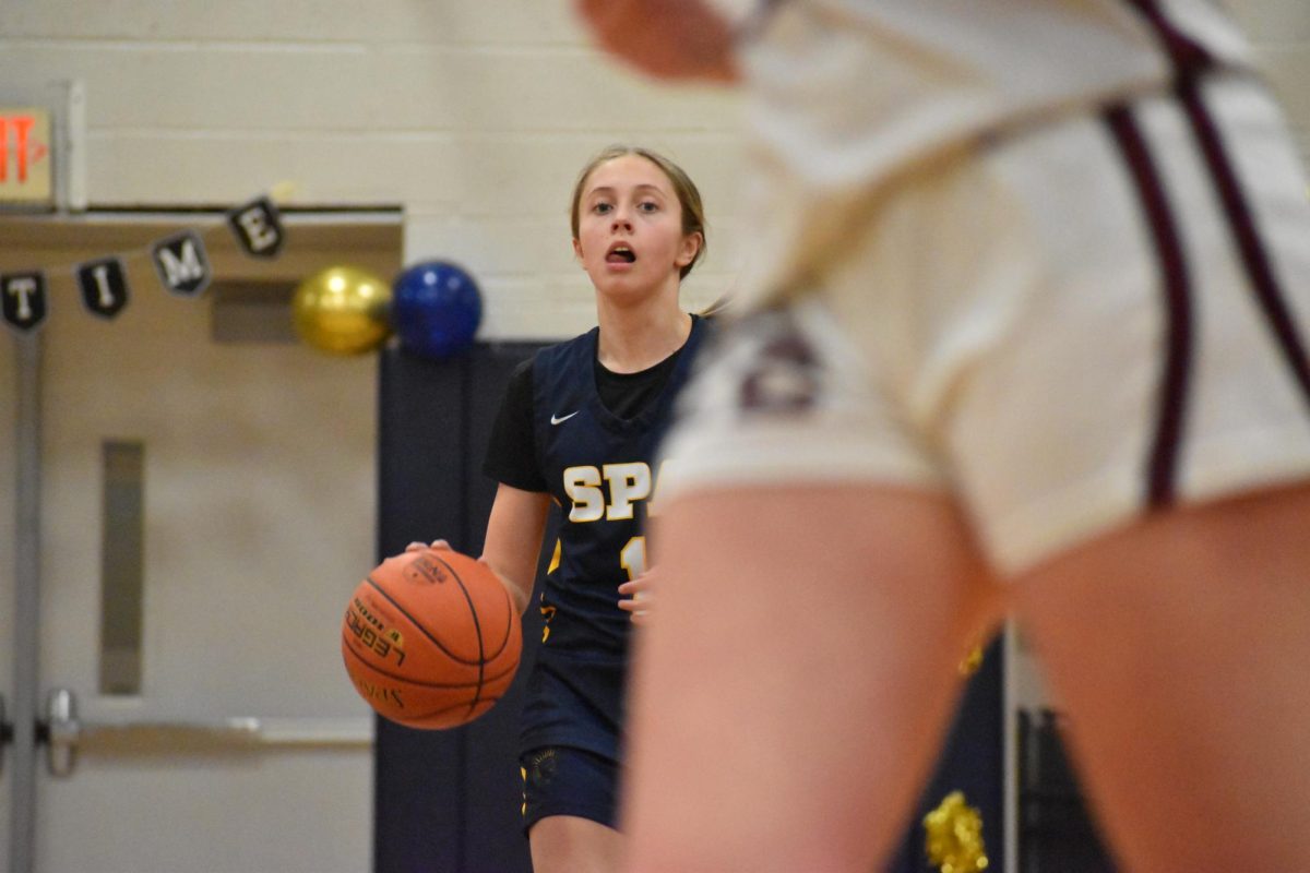 FOCUS. Mimi Kansas scouts out where to dribble or pass on the court, planning her next move. She was also a leading player in points.