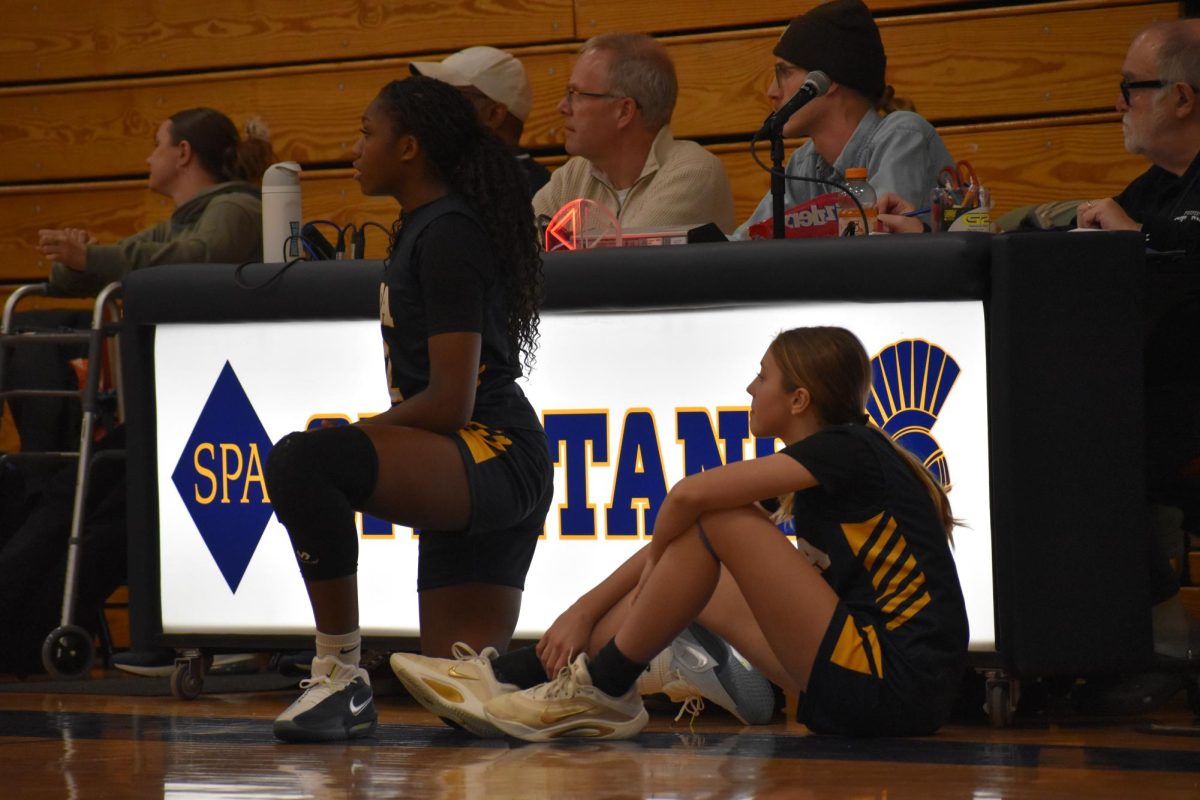 YOUNG SUBS. Two of the youngest players, Amaya Obi-Walker and Mimi Kansas prepare to sub into the game. Obi-Walker led the game in points and steals.