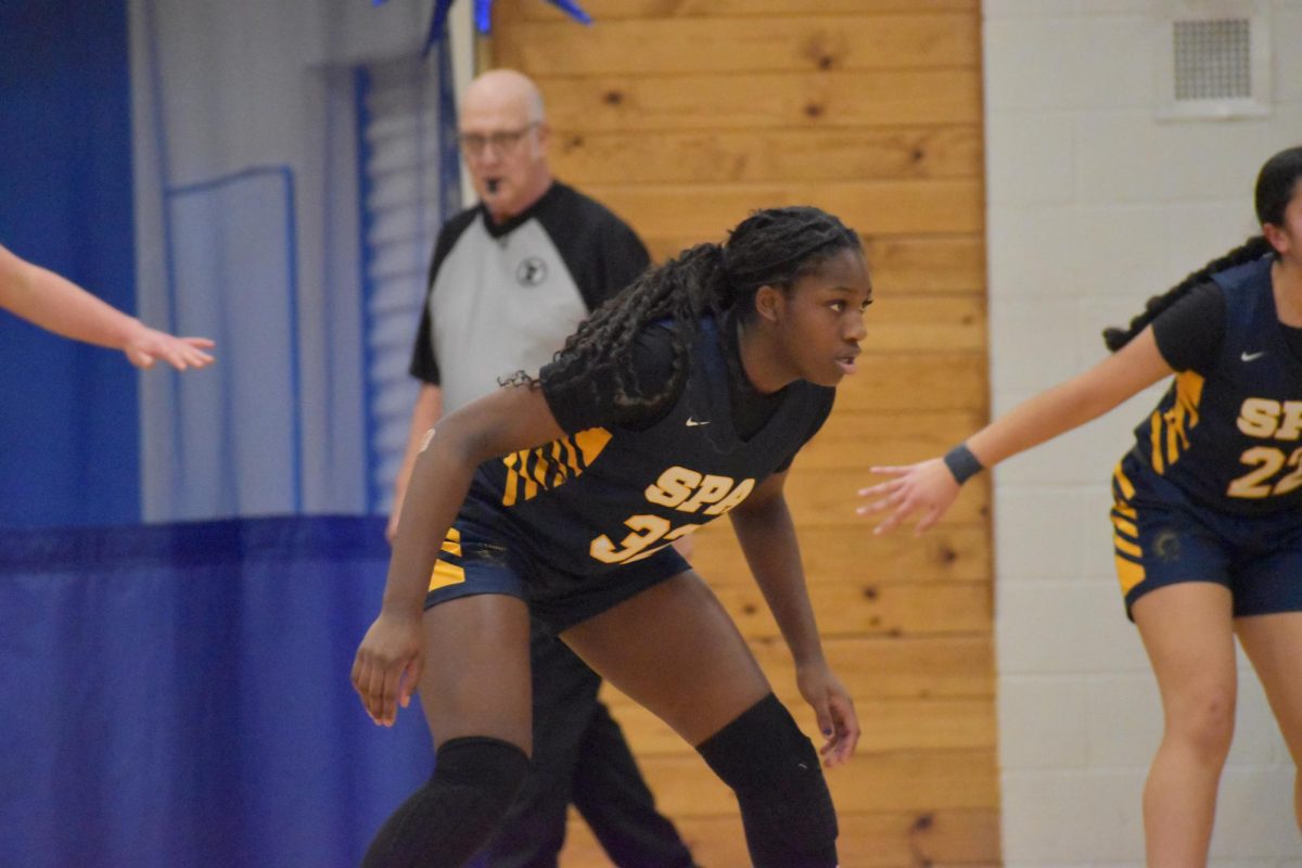 LOCKED IN. Obi-Walker stares down the other team on defense, ready to steal the ball.