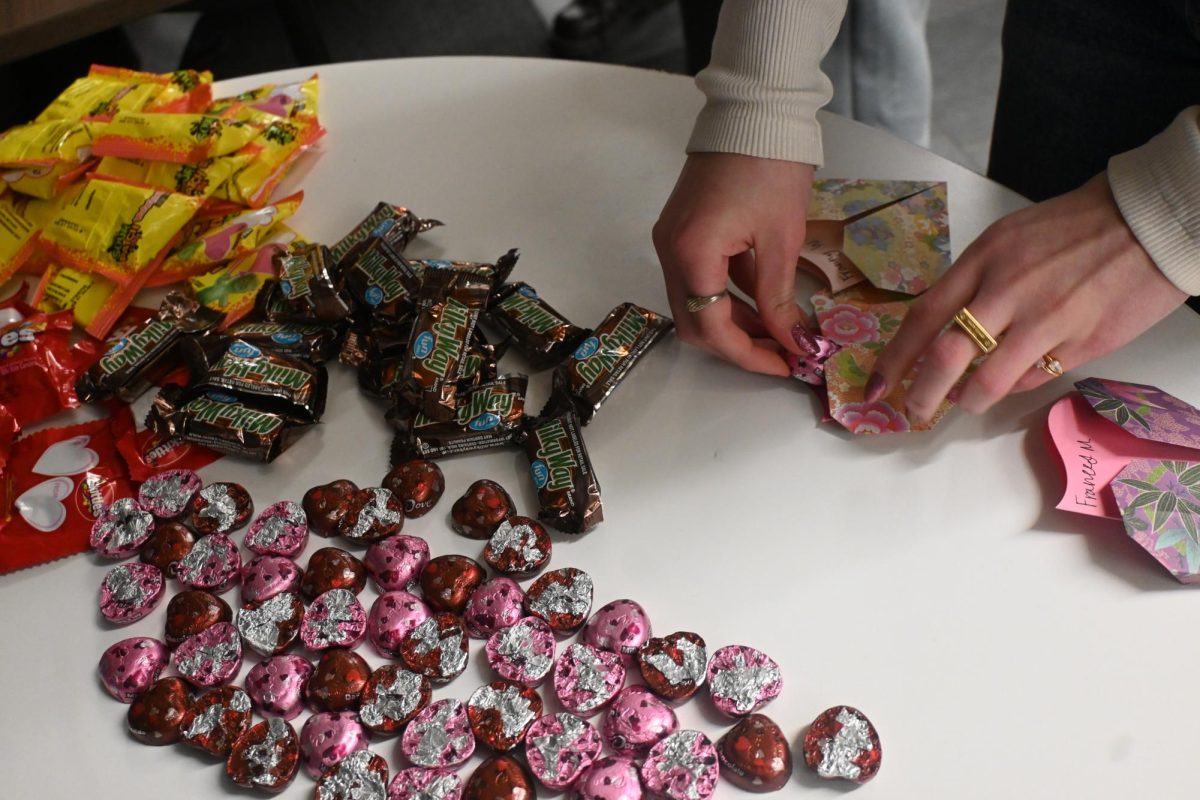 SWEET TREAT. Senior Beatrix Rhone selects a piece of candy for each candygram she made.