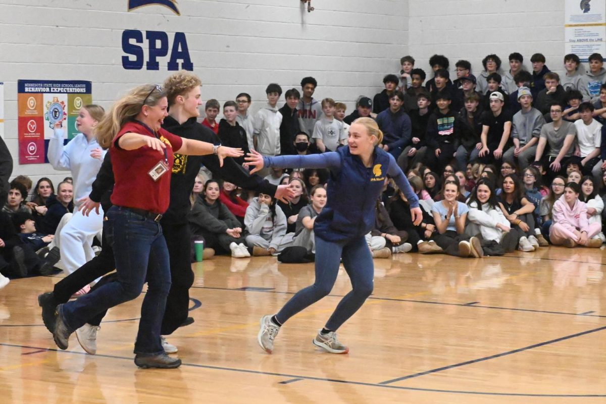 STEM TEACHERS. Captains rush to grab the nearest STEM teacher. Nordic Ski captain Maren Overgaard grabs middle school science teacher and her own mother, Stacy Overgaard.
