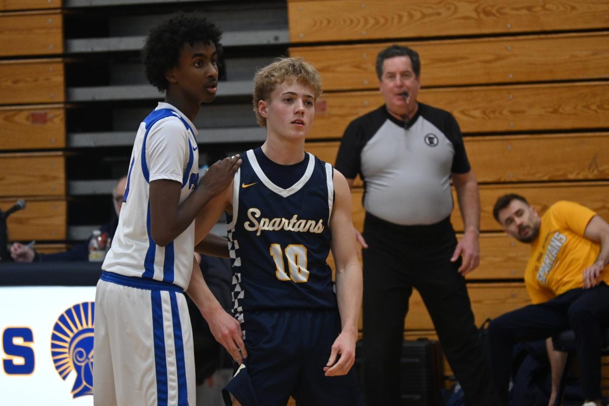 OFFENSIVE. Sophomore Palmer Olson gets ready to receive a pass.