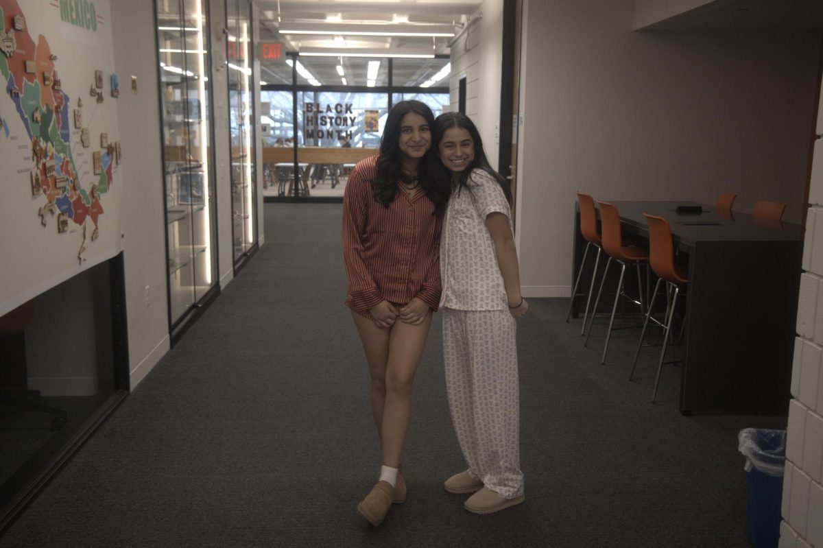 PINK PAJAMAS. Sophomores Zahra Sait and Sara Karmaliani both dress in pink pajama sets. 