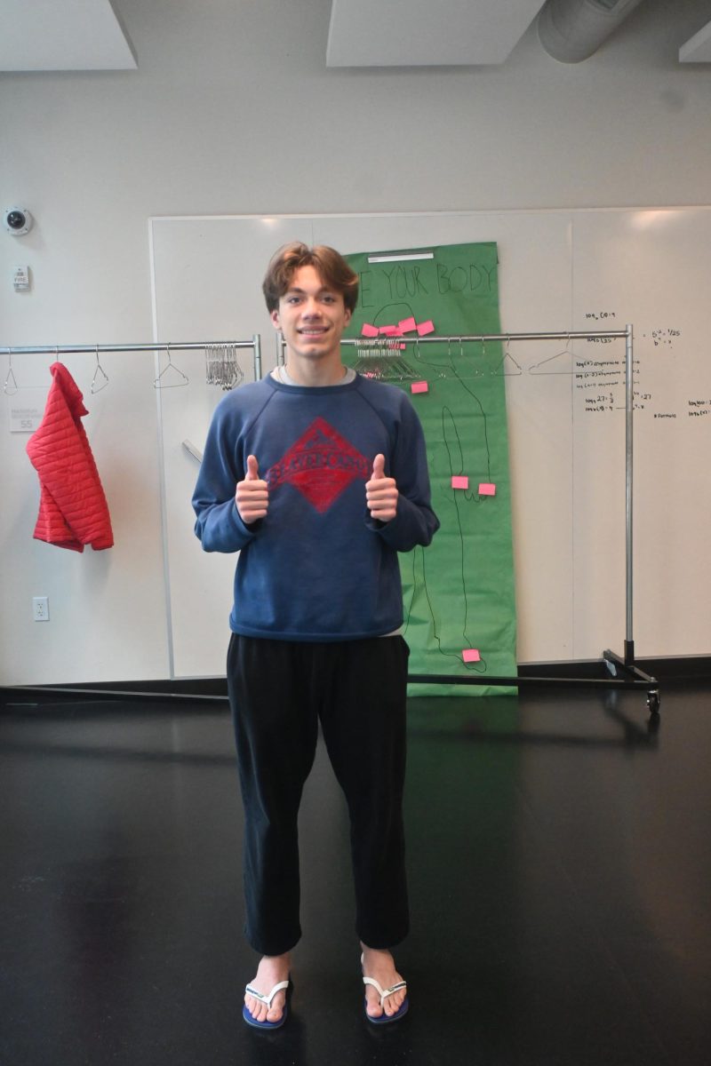 TOES OUT. Junior Nico Martin wears flip flops for toes out Tuesday. 