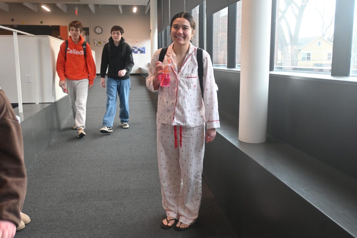 PJ SET. Sophomore Sophie Ferrer wears a pink set for pajama day with flip flops for toes out. 