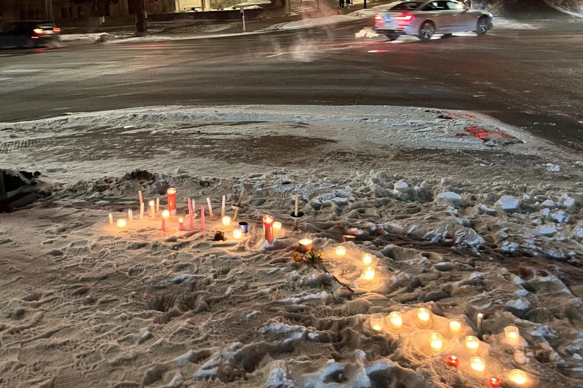 LIGHT IN THE DARK. Junior Florence Barrera visited the Summit and Lexington intersection on Jan 24. To honor Alex Pretti, Barrera contributed 20 candles to the site. (Submitted by Florence Barrera)