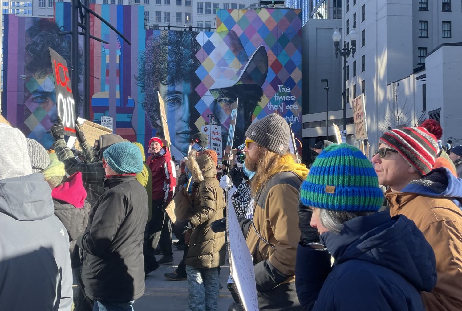 CHANGING TIMES. Minneapolis protesters are pictured on the Jan. 30 general strike, walking through downtown Minneapolis with signs and posters. The protest started and ended at Government Plaza, a courtyard outside of Minneapolis City Hall and other government office buildings. In the back is a mural of Minnesota native artist Bob Dylan featuring lyrics from his famous song 'The Times They Are A-Changin''