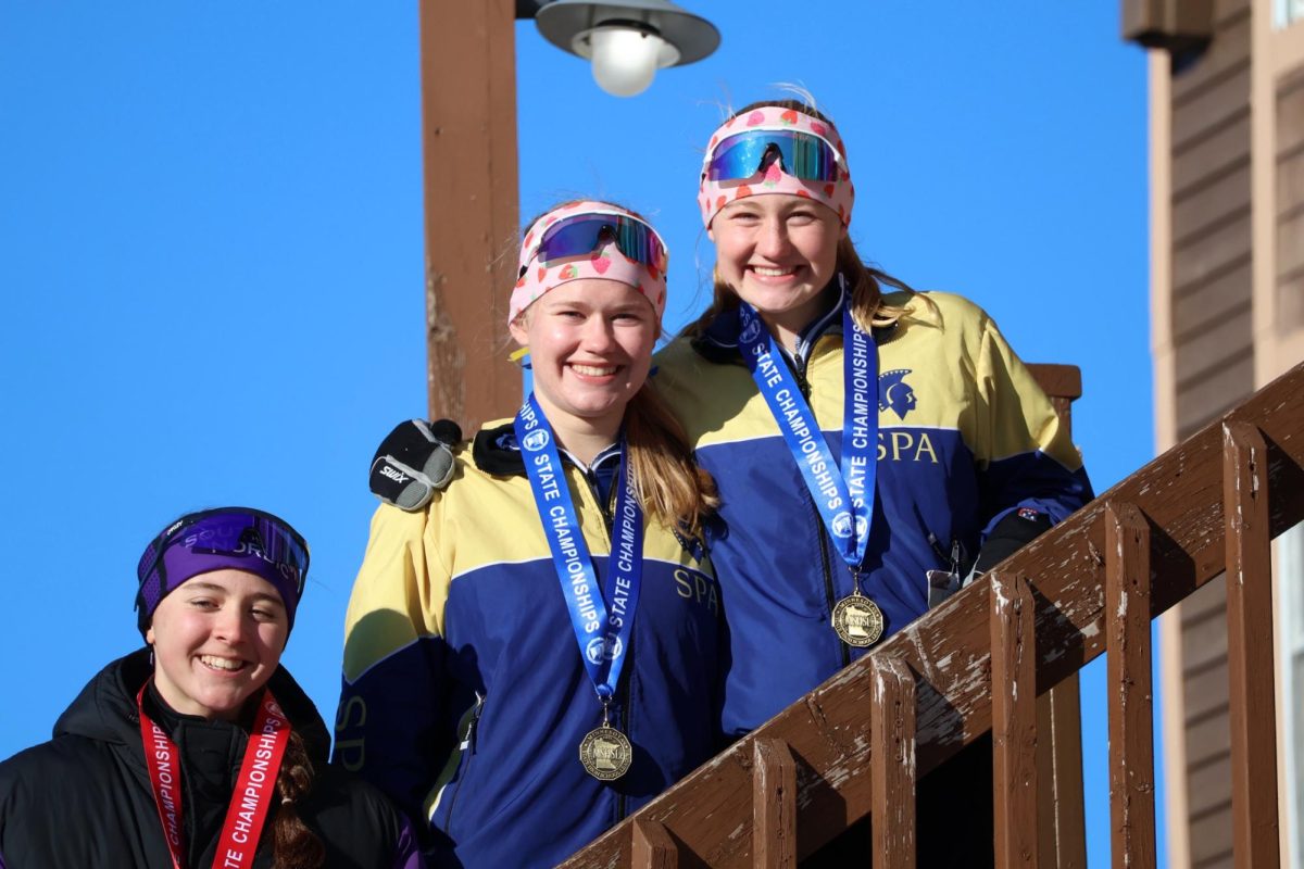 STATE WIN. Maren and Alyda Overgaard stand at the top of the stairs after receiving their first place medals. (Photo summitted by Maren Overgaard) 