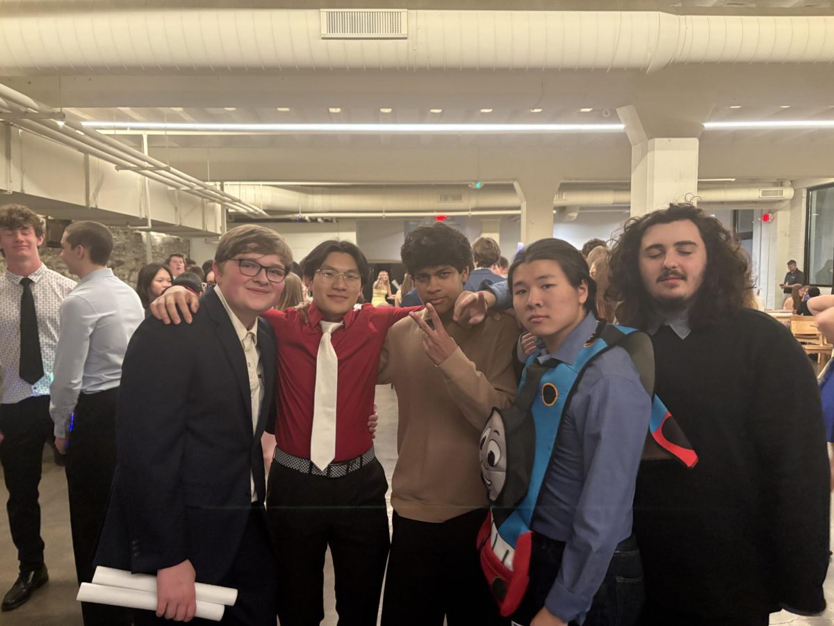 INTERMISSION. Seniors Johann, Ethan, Juan, Minh, and Howard, take a break from the dance floor to talk and get drinks. 
