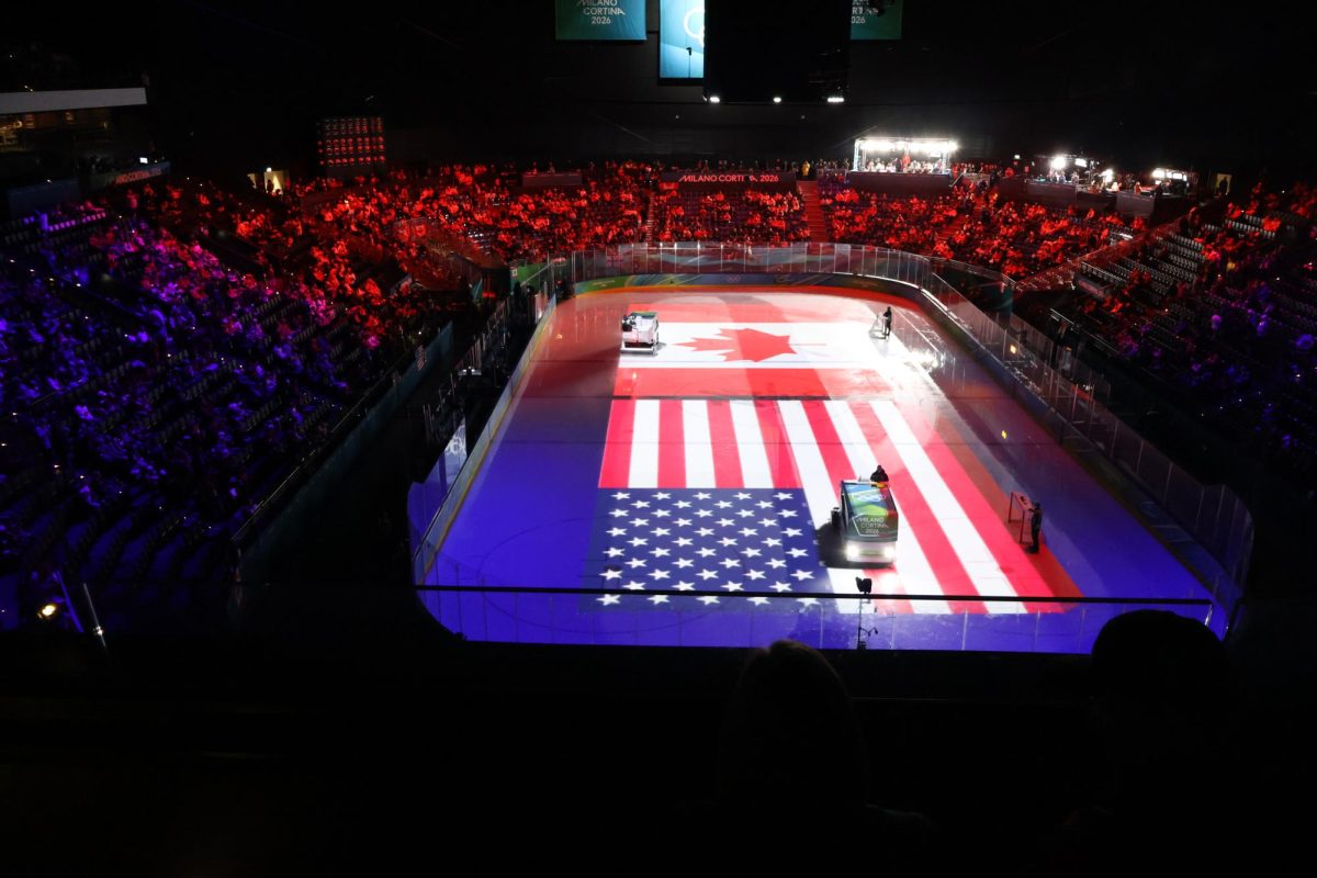 LIGHTS. On the ice, the American and Canadian flags are displayed. 