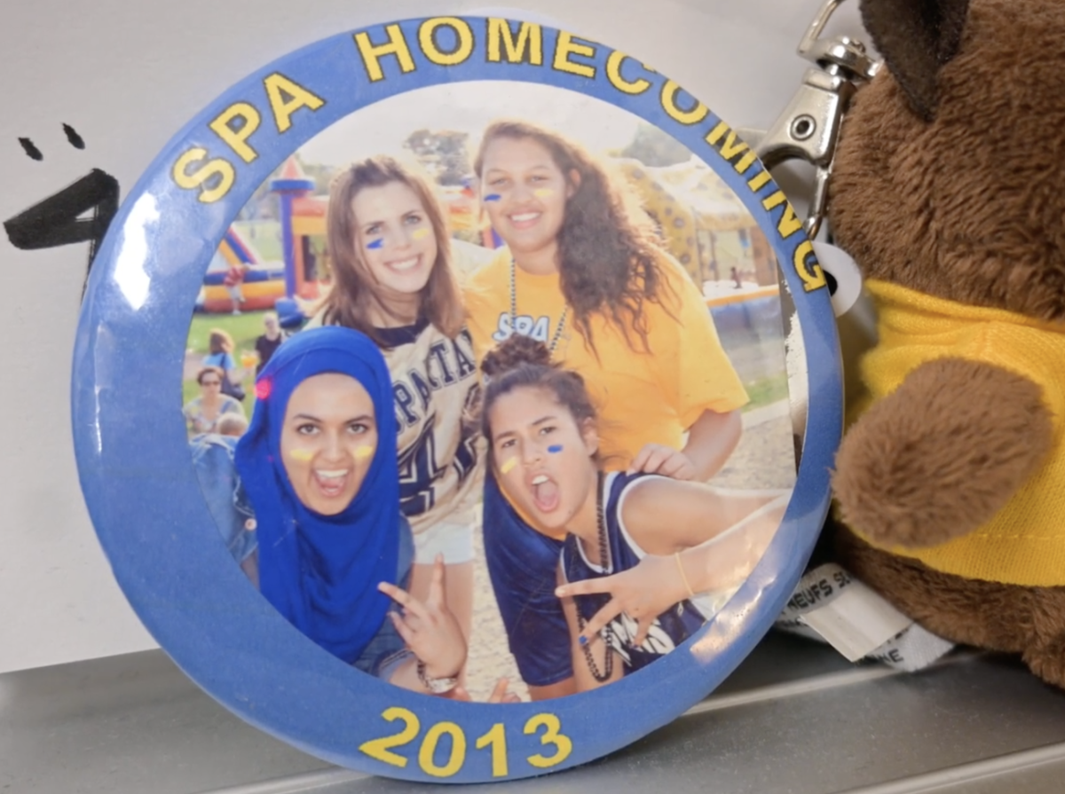 HOMECOMINGS PAST. Irish keeps a memento of her time at the upper school behind her desk. 
