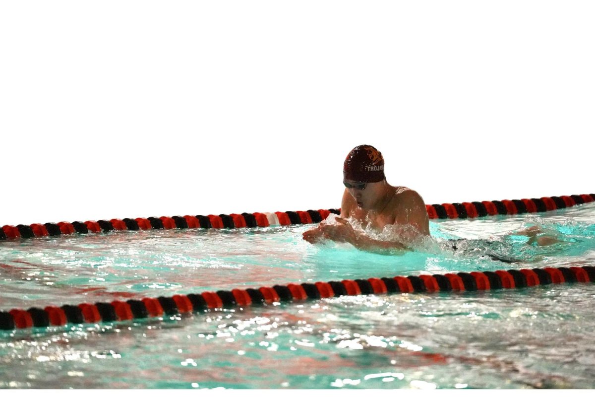 Boys swim and dive captain Ben Lee swims the 100-yard breaststroke during a rivalry meet against Central High School. 