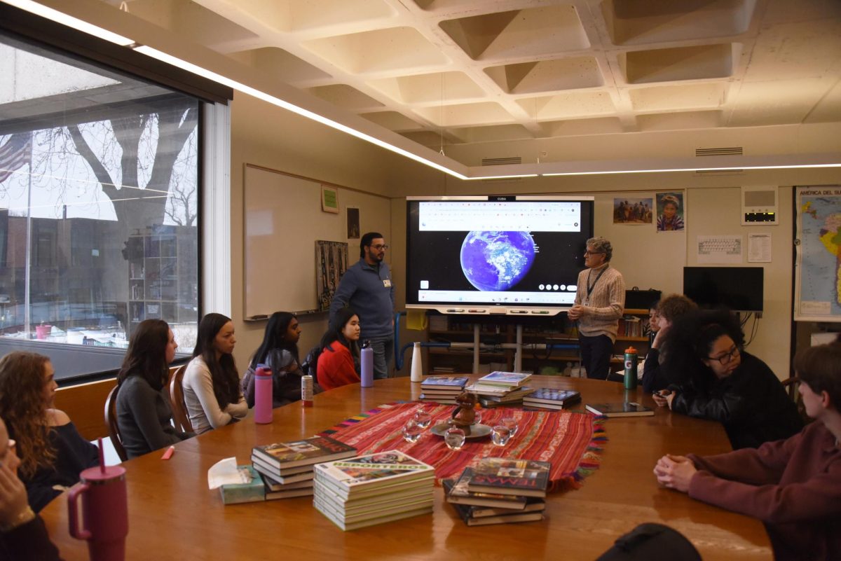 PERTINENT PRESENTATION. Guest speaker Carlos Piñero uses Google Earth to talk about his life in Venezuela. His lesson gave context to the U.S. strikes on Venezuelan military bases and the indictment and abduction of Venezuelan President Nicolás Maduro on Jan. 3. “I was hoping for students to be able to ask questions to somebody who is currently living under that repressive system,” Christine Piñero said.