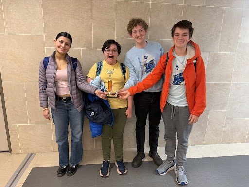 NATIONALS BOUND. The Quiz Bowl team holding their trophy after qualifying to nationals.