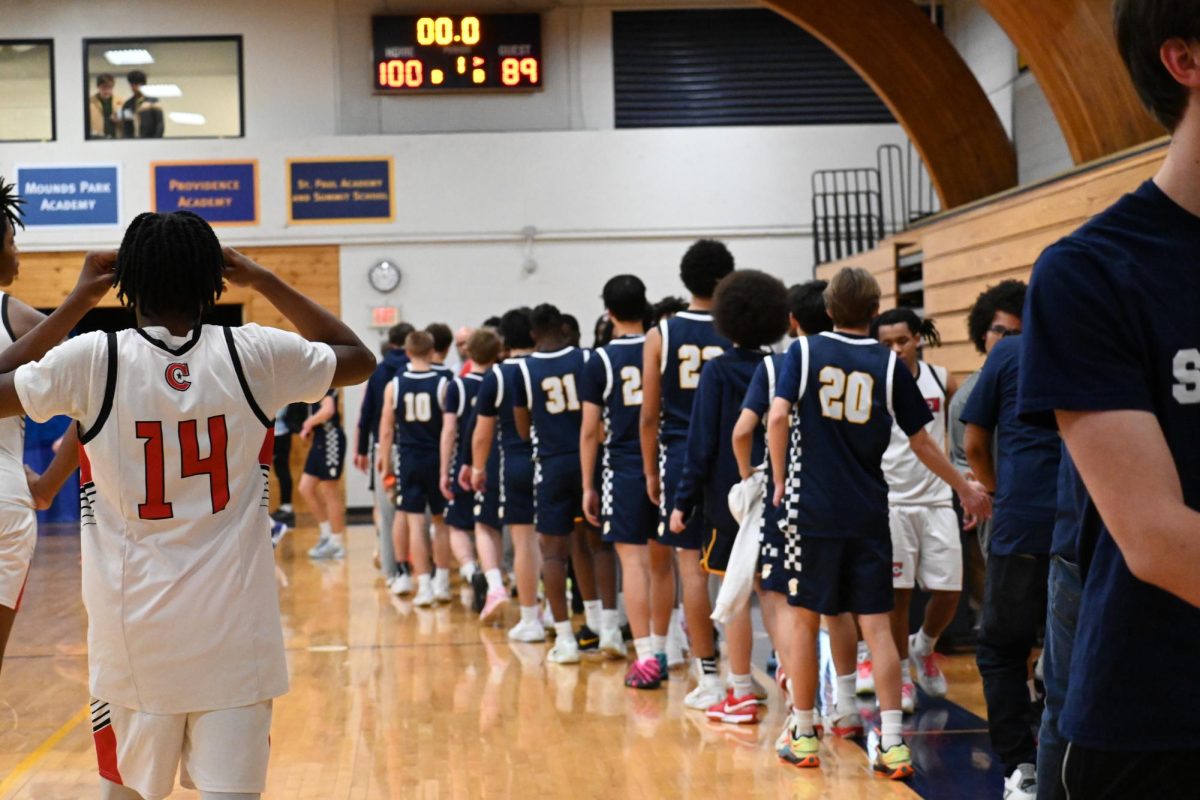 GOOD GAME. Camden High School and the Spartans line up to high five each other after the game.