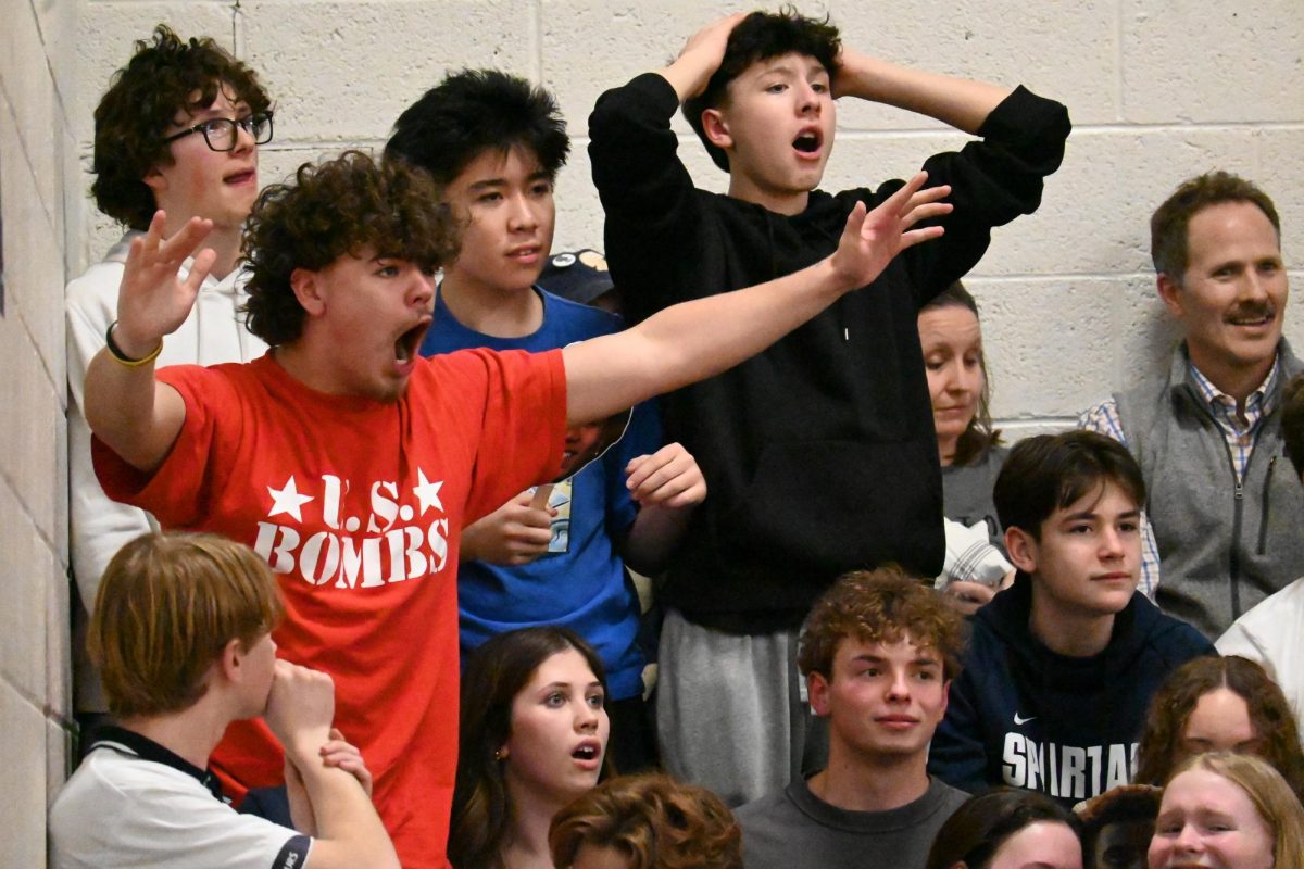 BLAME THE REF. After a foul was called on the Spartans, student fans boo the ref.