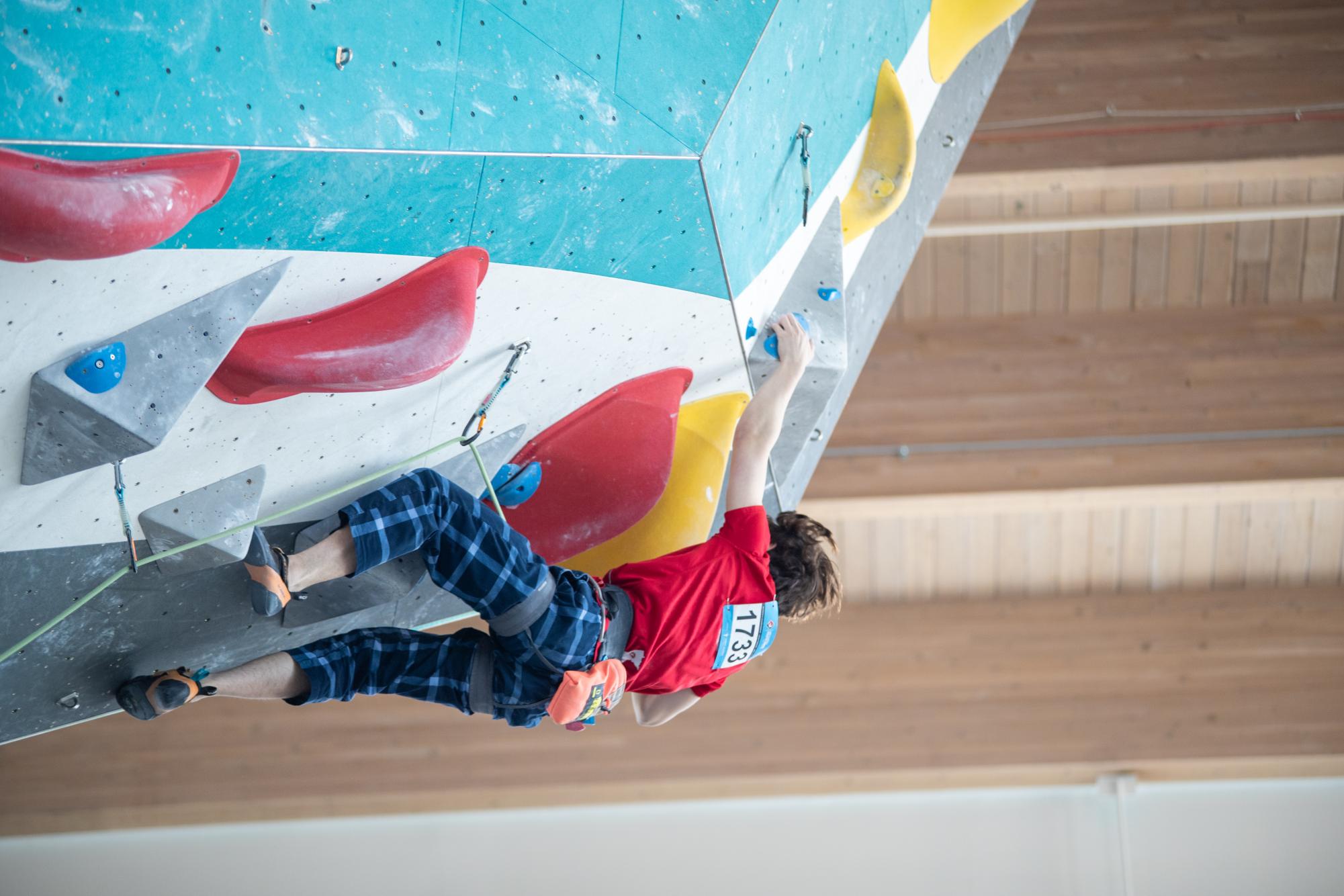 CLIMBING TIME. Sophomore Jianli Windorski climbs to the top at a climbing gym.