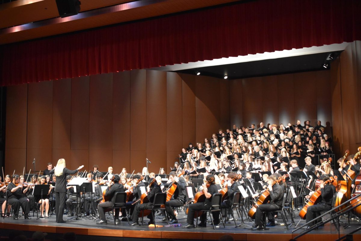 FINAL LYRIC. To bring the annual spring concert to an end, the orchestra and choir ensembles performed their final piece, Hallelujah, which received them a standing ovation.