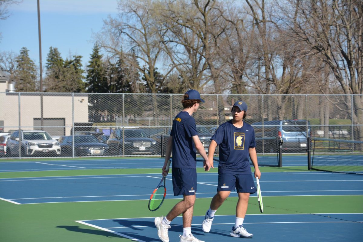 HIGH FIVES. Words of encouragement and a moment of focus define the chemistry between Cammack and Senaratna. Playing at the No. 1 doubles spot, the duo relies on constant communication to navigate the highs and lows of the match, ensuring they are mentally prepared for every point.