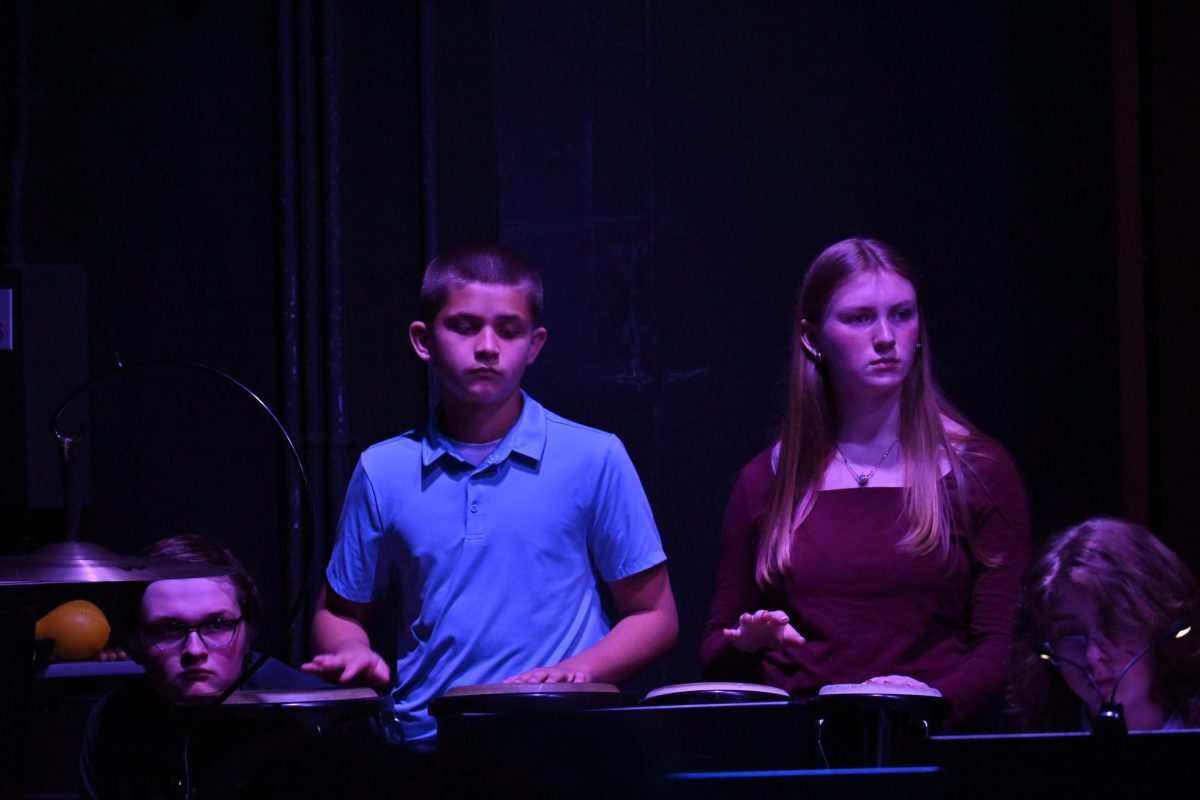 BONGOS AND CONGOS. Donek Marthaler and Sydney King keep up the rhythm in the percussion section during "Such Sweet Thunder" 