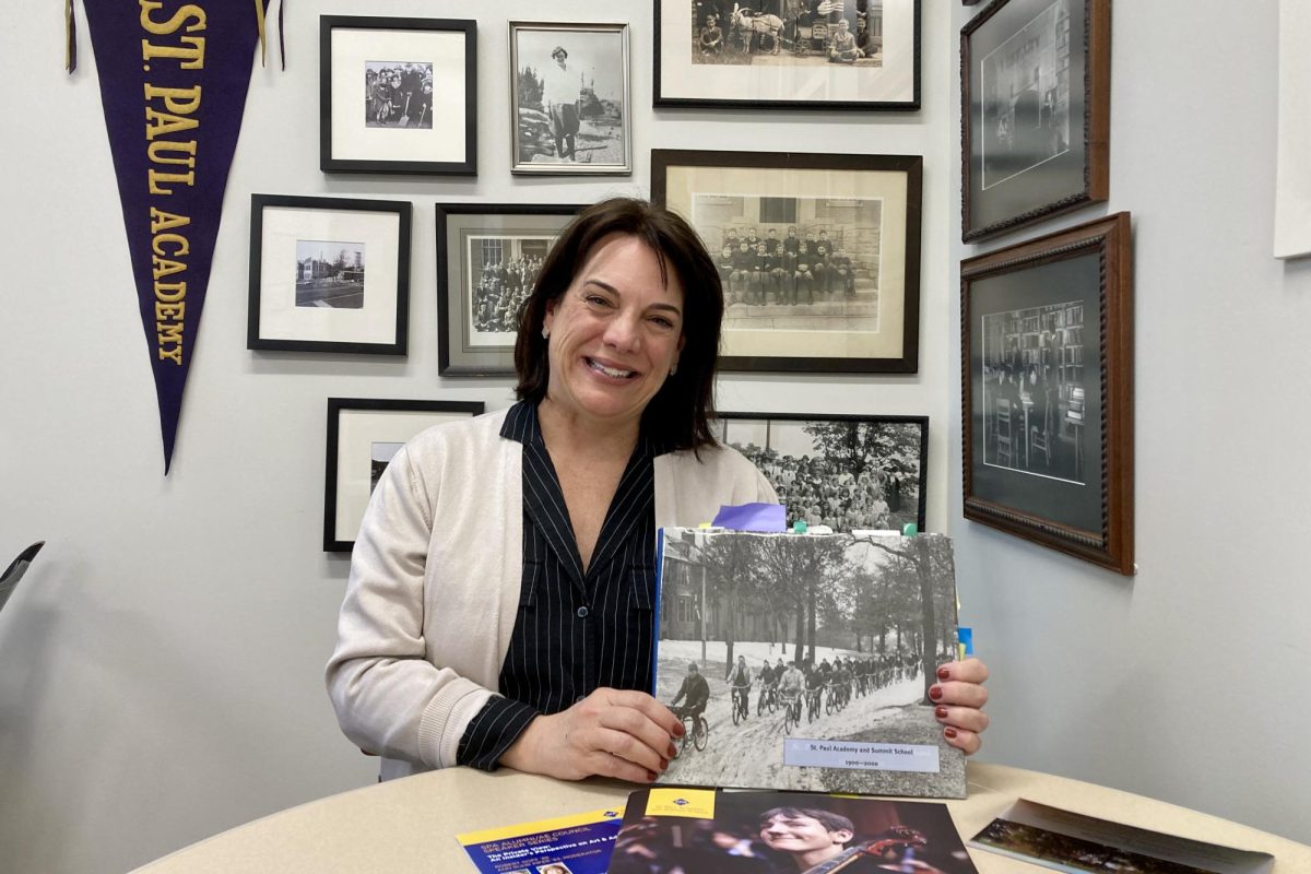 SPARTAN PRIDE. Director of Institutional Advancement Sarah Johnson poses in her office with Spartan memorabilia.
