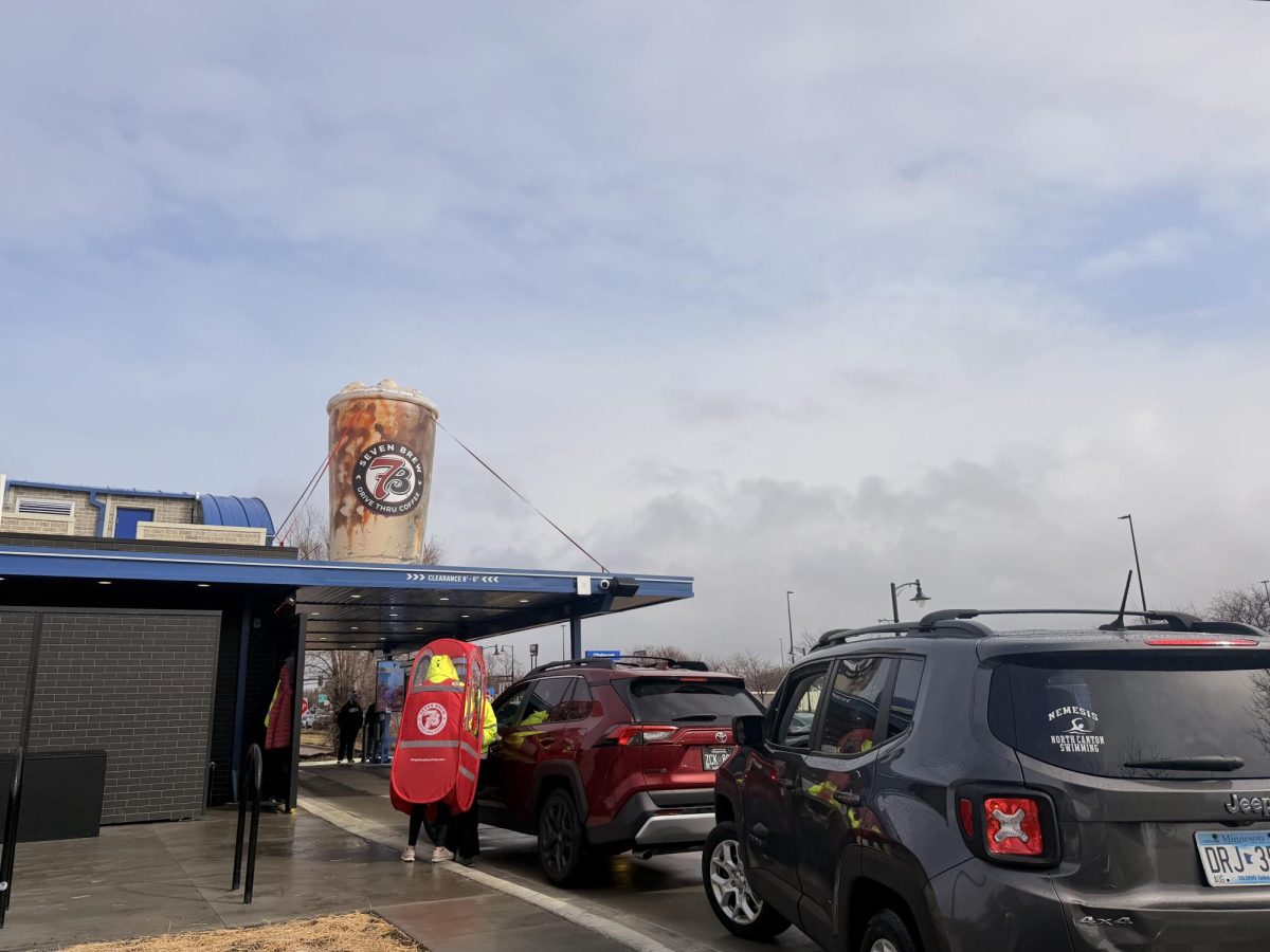 7 BREW. Workers blasted music for opening day as customers came through the drive-thru.