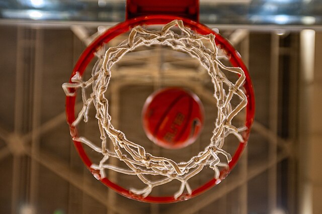 A basketball falls through a hoop during the Samurai Challenge at Yokota Air Base, Japan, March 27, 2026. The challenge is a 12-month series of physical fitness events designed to test strength, enhance unit camaraderie, and serve as a proving ground for warrior ethos across the installation. (U.S. Air Force photo by Airman 1st Class David S. Calcote)