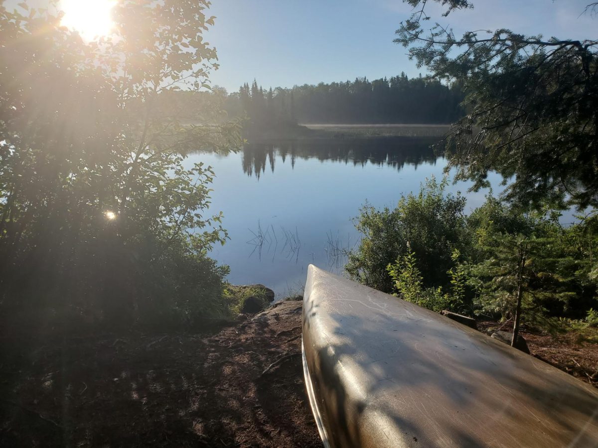 CANOE. A beautiful canoe in front of the sunrise.