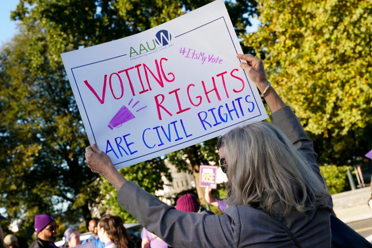 People protest on the day the U.S. Supreme Court hears arguments regarding the composition of Louisiana electoral districts, in Washington, D.C., U.S., October 15, 2025. REUTERS/Elizabeth Frantz