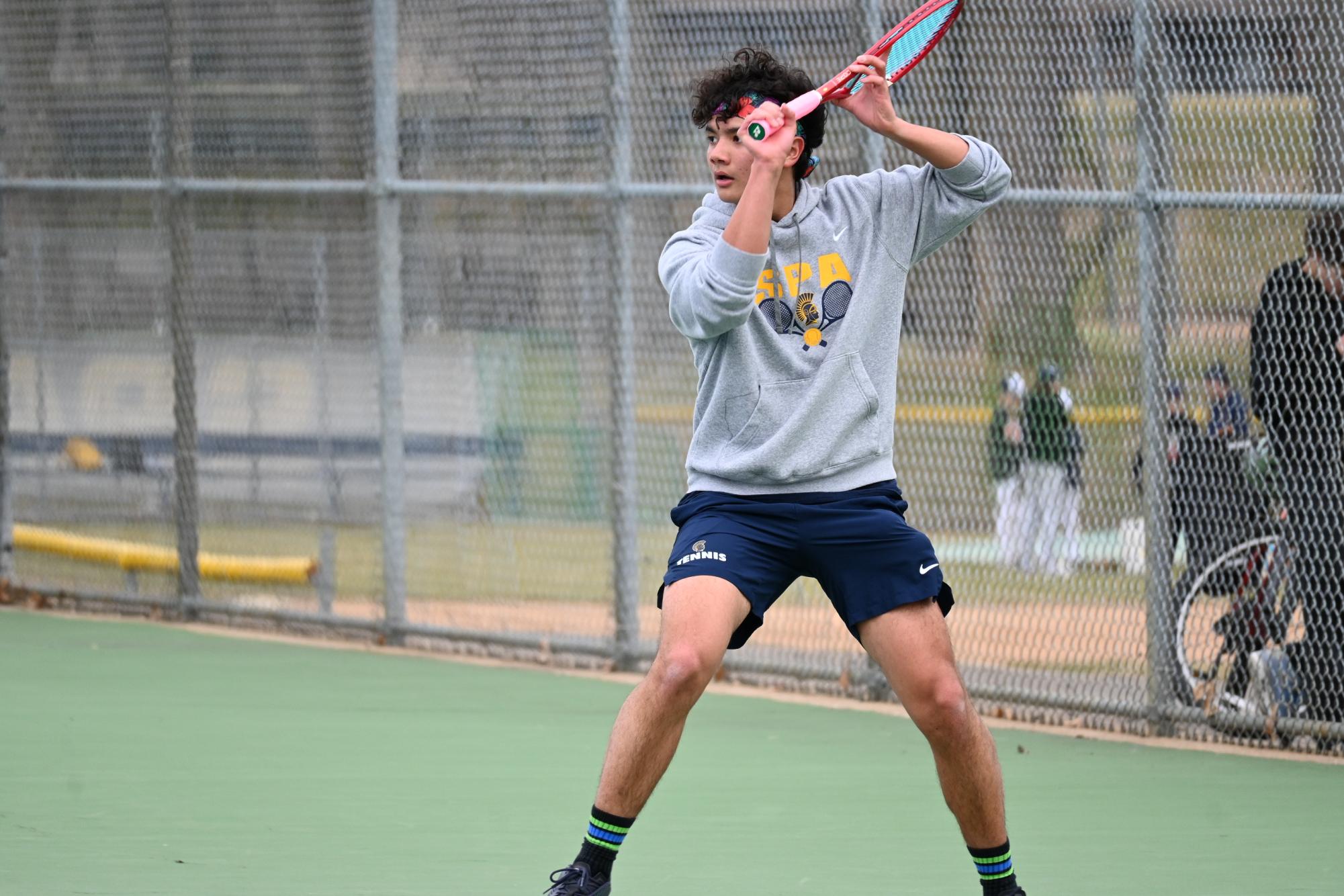 SLICE. Second-year sophomore Lucas Laguna sets his feet to hit a slice backhand.