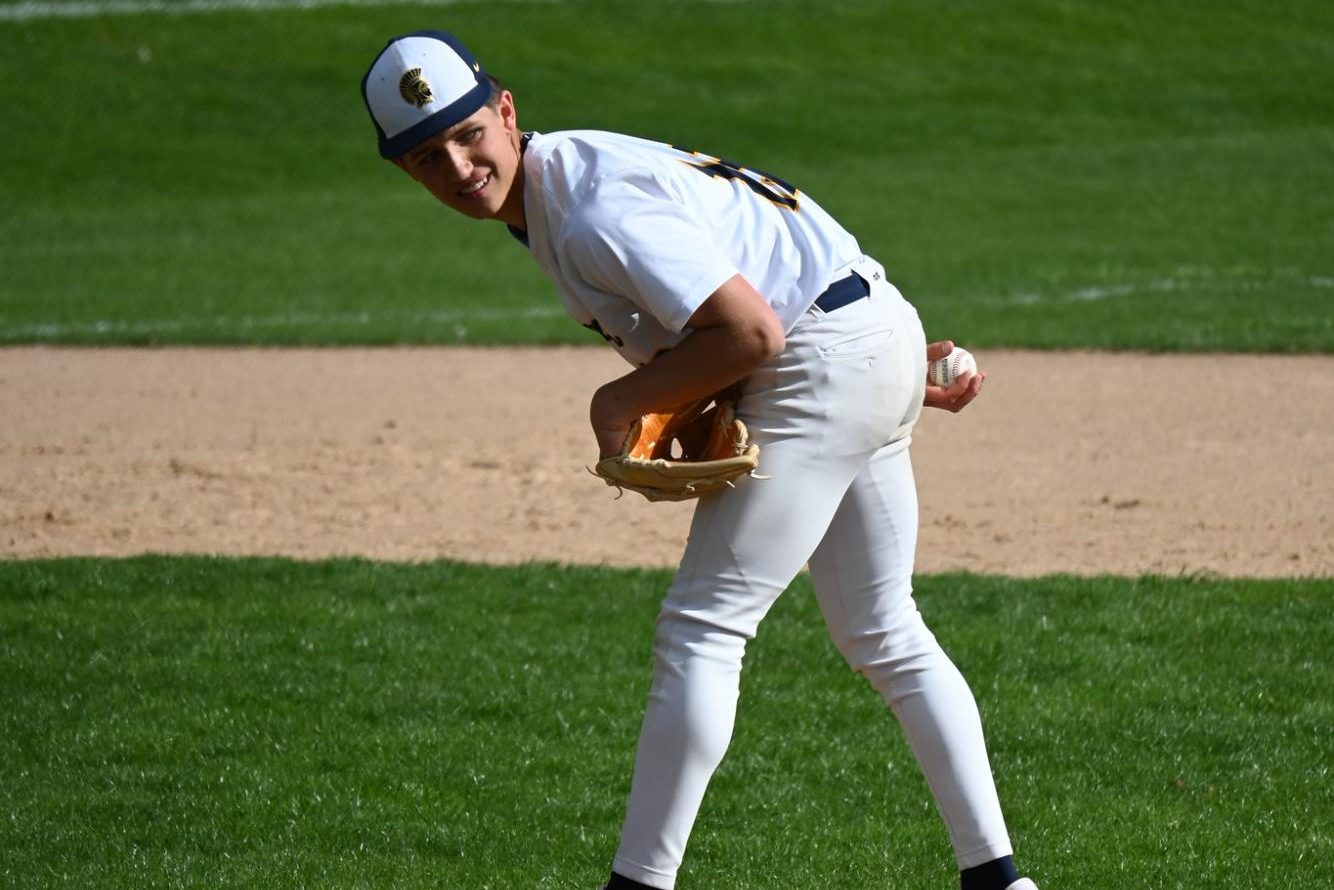 HAWK'S EYE. Ninth-grader pitcher Quinn Wall makes sure no one is stealing