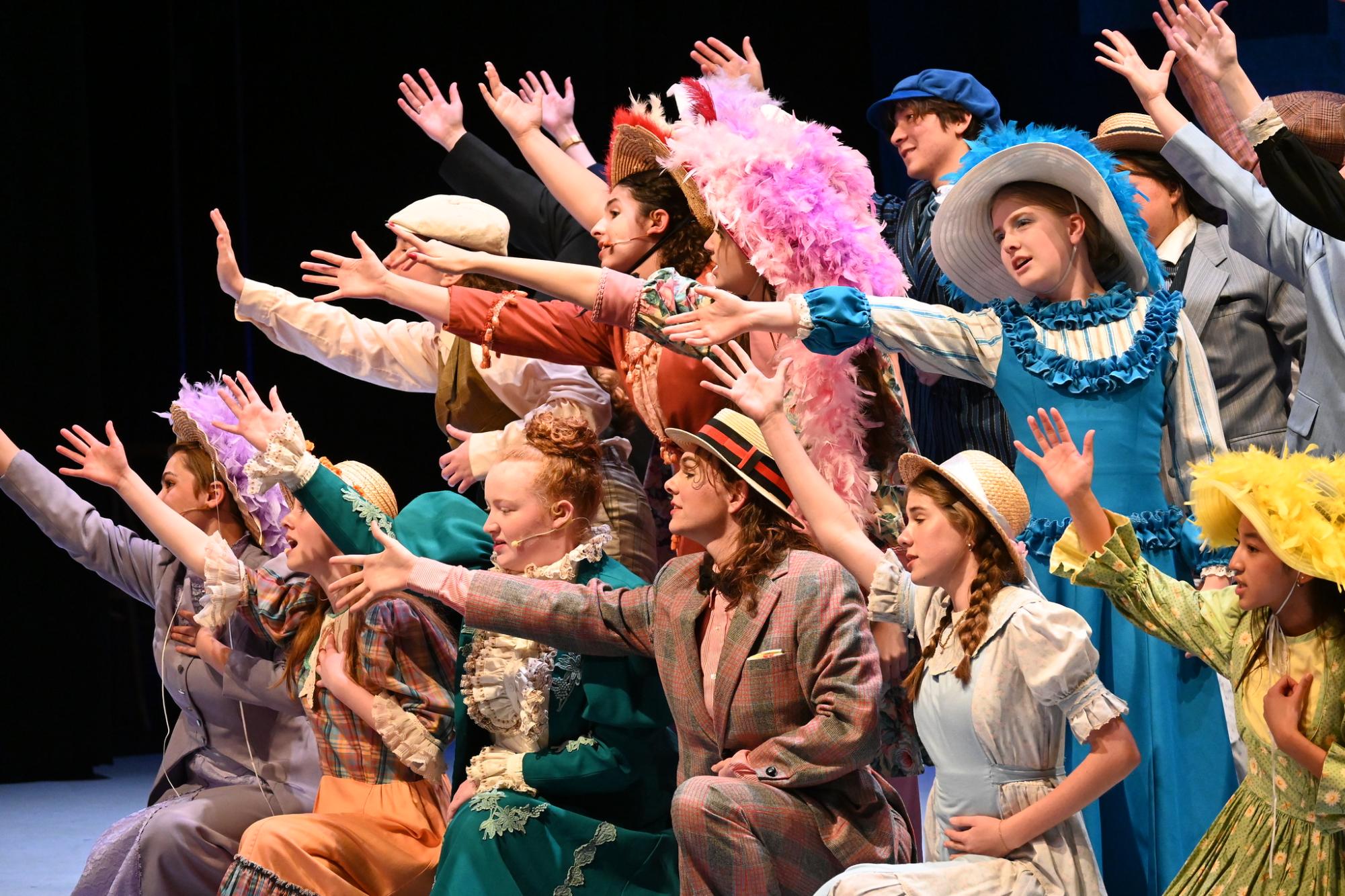 SINGING AWAY. The cast of "The Music Man" passionately singing during the middle of the play. The group spent months rehearsing together and put their hard work to show over three performances