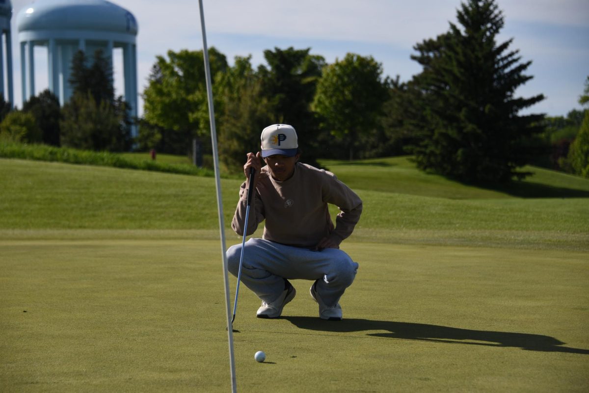 CONCENTRATION. Boys gold captain, junior Quentin Sentz, squats and watches the ball attentively. 