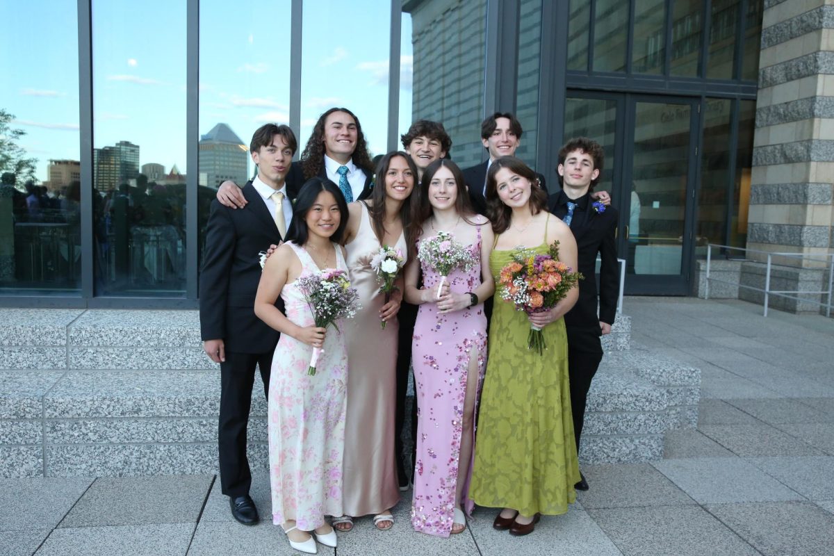 POSE. Traditionally, students take many photos with friends before prom.