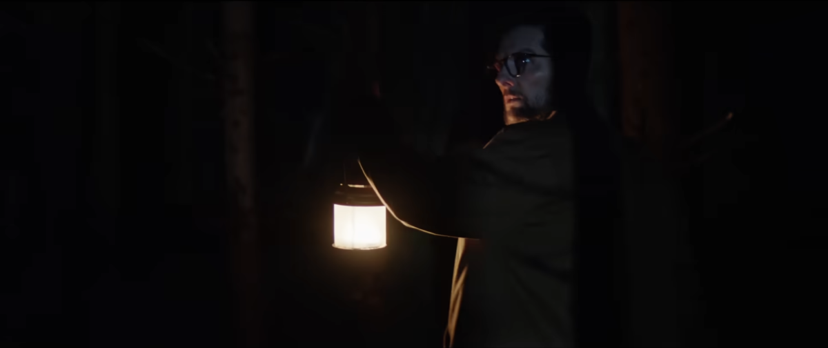 IN THE DARK. Hokum's greatest success comes from a curated atmosphere that is genuinely scary, alongside many effective jump scares. (NEON Studios. Screenshot from the Official "Hokum" Trailer)