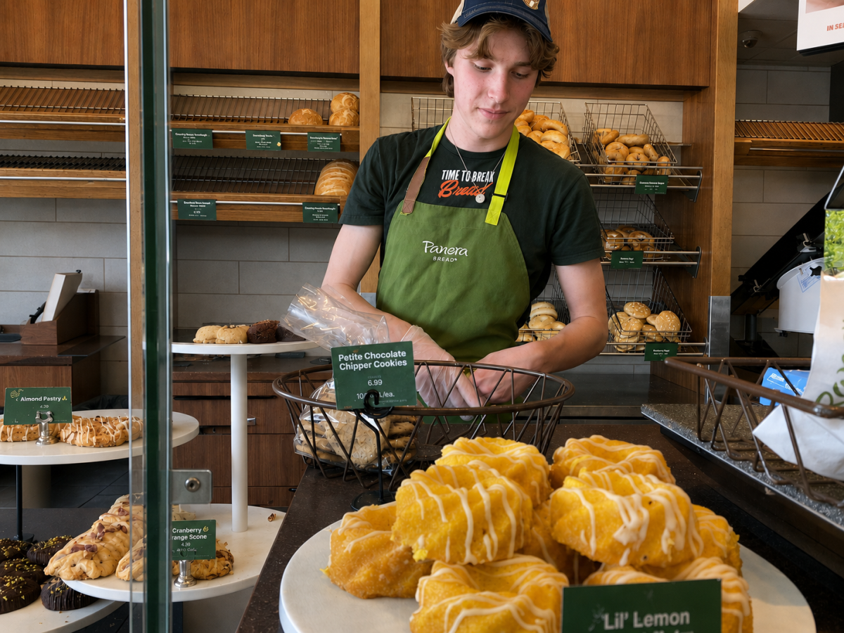ON THE CLOCK. Junior Miles Messier bags pastries during an after-school shift at Panera Bread. Messier balances evening work shifts with homework and school responsibilities.